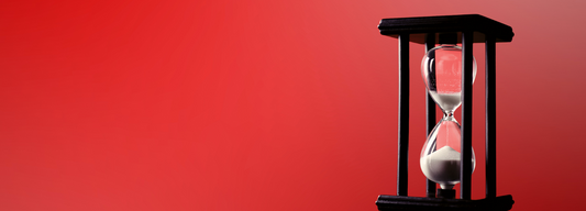 hourglass on red background