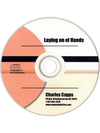 CD with 'Laying on of Hands' by Charles Capps on a white background