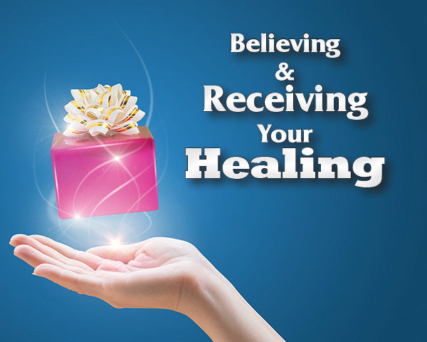 Hand holding a glowing pink gift box with a white flower on a blue background, accompanied by text 'Believing & Receiving Your Healing'. https://cdn.shopify.com/s/files/1/1092/3380/files/2026_Believing_and_Receving_Your_Healing_1920x900_b23e4989-10ca-45b0-a006-834c93249f0a.jpg?v=1782317355