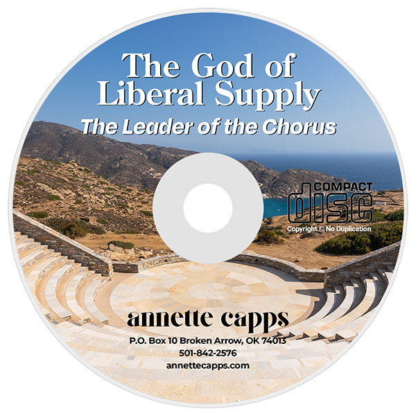 A compact disc with printed cover art showing an outdoor amphitheater and mountains under a blue sky. The disc text reads 'The God of Liberal Supply', 'The Leader of the Chorus', 'Compact Disc', and 'Annette Capps'. cappsministries.com