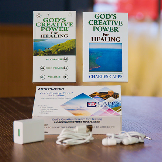 Two books titled 'God's Creative Power for Healing' by Charles Capps, an MP3 player, earbuds, charger and charging cord. cappsministries.com
