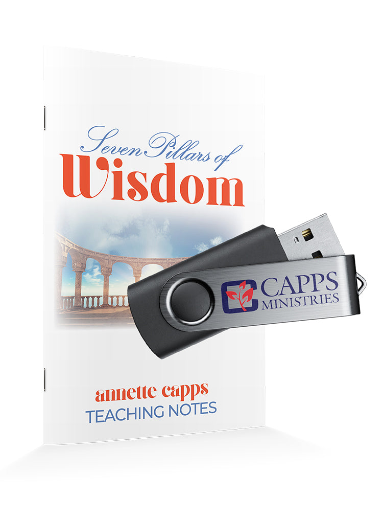 USB flash drive with Capps Ministries logo next to a note book titled 'Seven Pillars of Wisdom' by annette capps www.cappsministries.com