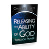 Book cover of 'Releasing the Ability of God Through Prayer' by Charles Capps with a world map background.