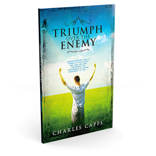 Book titled 'Triumph Over the Enemy' by Charles Capps with a person in a field on the cover.