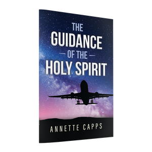 Book cover of 'The Guidance of the Holy Spirit' by Annette Capps with a silhouette of an airplane against a starry sky.