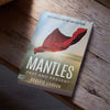 Book titled 'Mantles: Past and Present' by Roberts Liardon on a wooden surface