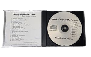 CD with 'Healing Songs of His Presence' by Vicki Jamison Peterson on a white background. Shows open CD case with inside of insert with song list