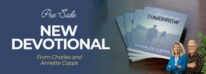   Promotional banner for a new devotional by Charles and Annette Capps with books on a table. 